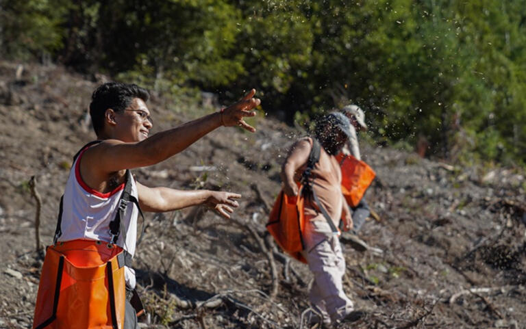smiling while holding camera